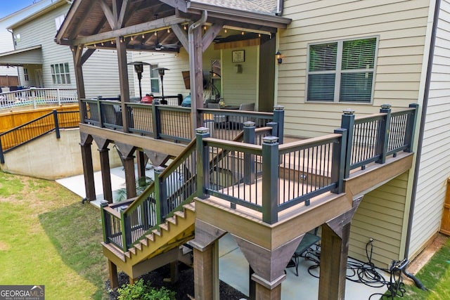 406 Fernstone Dr, Canton, GA 30114 - deck with stairway, a patio area, and a lawn