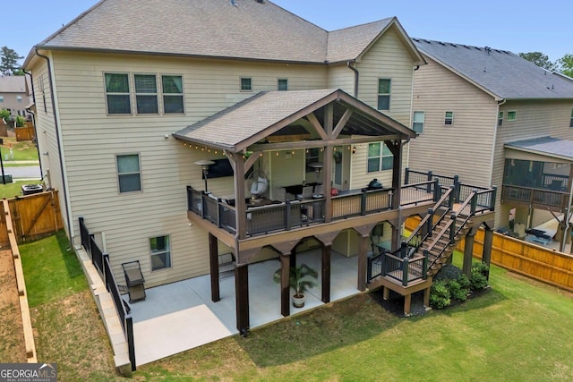 406 Fernstone Dr, Canton, GA 30114 - back of property with a patio area, a deck, roof with shingles, and stairs