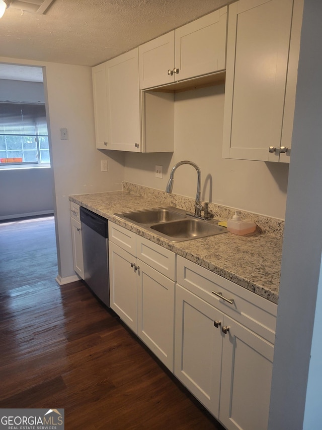 5579 Marbut Rd, Lithonia, GA 30058 - kitchen featuring dishwasher, a sink, dark wood finished floors, and white cabinets