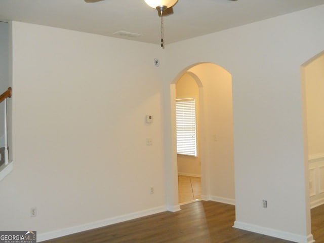 4750 Crinklepoint Ct, Douglasville, GA 30134 - unfurnished room with wood finished floors, ceiling fan, and arched walkways