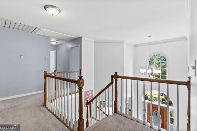 570 Hunt River Way, Suwanee, GA 30024 - hall with attic access, an upstairs landing, carpet flooring, a chandelier, and baseboards