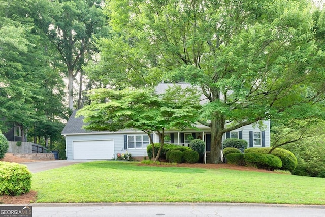 241 Tweed Ct, Sugar Hill, GA 30518 - obstructed view of property featuring asphalt driveway, a front yard, and an attached garage