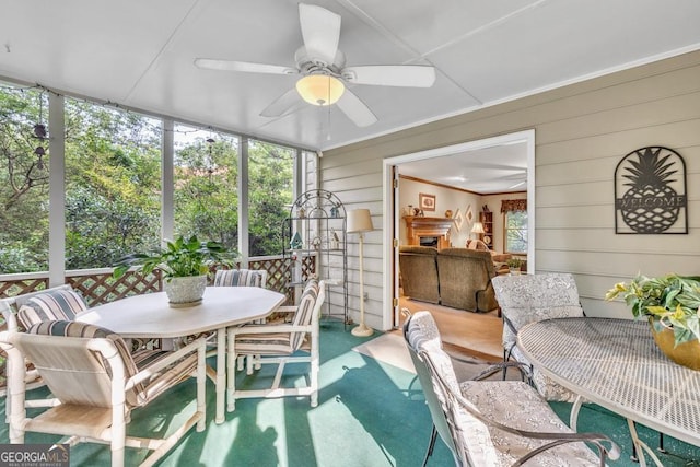 241 Tweed Ct, Sugar Hill, GA 30518 - sunroom featuring outdoor dining space, a ceiling fan, and healthy amount of natural light