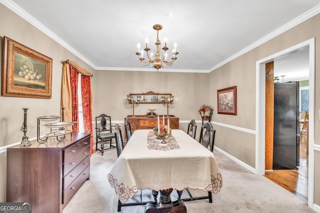 241 Tweed Ct, Sugar Hill, GA 30518 - dining area featuring a chandelier, crown molding, and light colored carpet