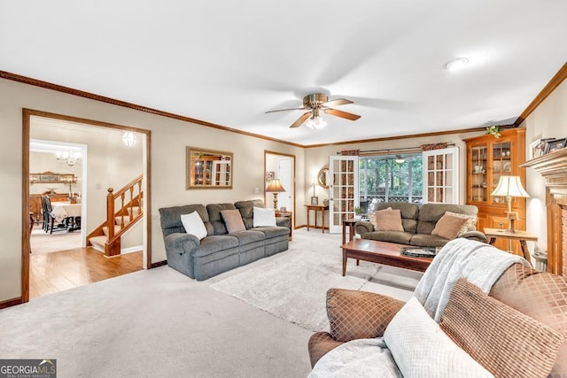 241 Tweed Ct, Sugar Hill, GA 30518 - carpeted living area with stairway, a ceiling fan, ornamental molding, and a chandelier
