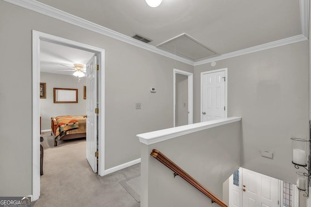 241 Tweed Ct, Sugar Hill, GA 30518 - corridor featuring attic access, light carpet, crown molding, and an upstairs landing