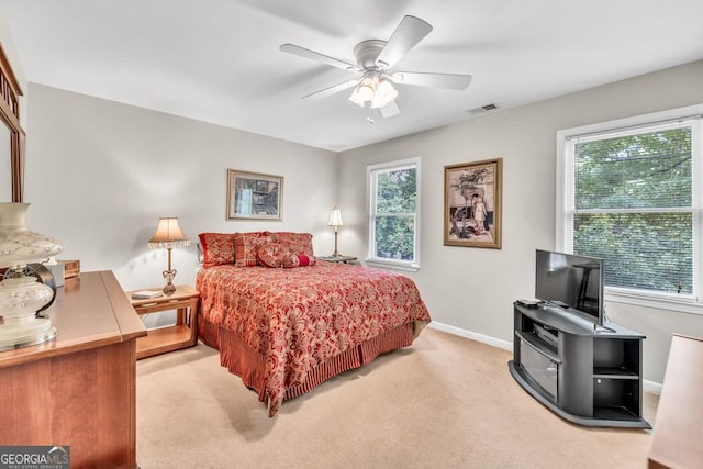 241 Tweed Ct, Sugar Hill, GA 30518 - carpeted bedroom with baseboards and a ceiling fan