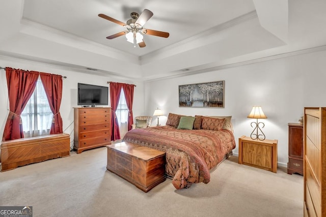 241 Tweed Ct, Sugar Hill, GA 30518 - bedroom featuring a tray ceiling, ornamental molding, multiple windows, carpet flooring, and ceiling fan