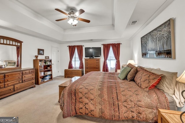 241 Tweed Ct, Sugar Hill, GA 30518 - carpeted bedroom featuring a raised ceiling, crown molding, and a ceiling fan