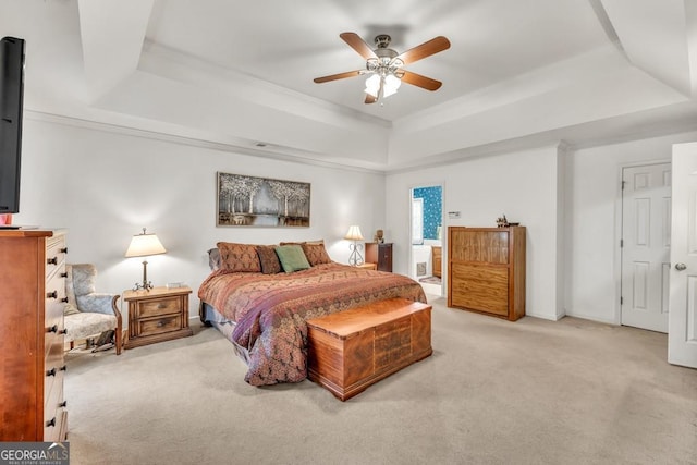 241 Tweed Ct, Sugar Hill, GA 30518 - bedroom with a tray ceiling, carpet floors, crown molding, a ceiling fan, and connected bathroom