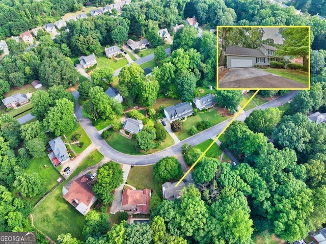 241 Tweed Ct, Sugar Hill, GA 30518 - aerial view of property and surrounding area featuring nearby suburban area and property parcel outlined
