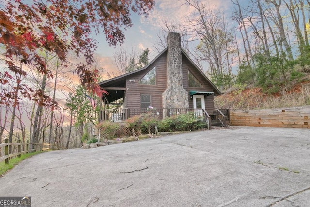 87 Owltown Dr Unit L40, Ellijay, GA 30536 - property exterior at dusk featuring a chimney