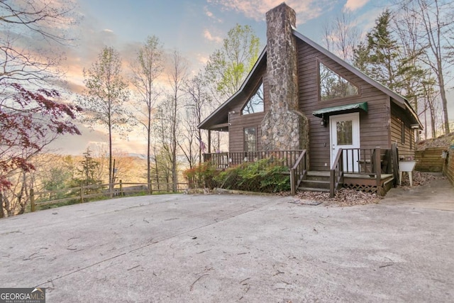 87 Owltown Dr Unit L40, Ellijay, GA 30536 - back of property at dusk featuring a chimney