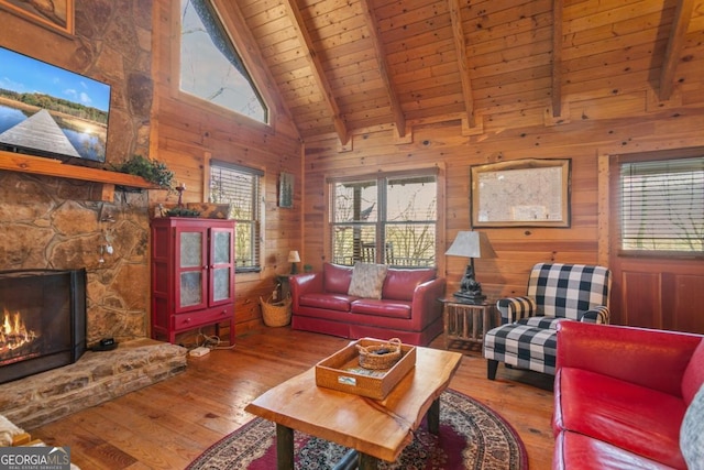 87 Owltown Dr Unit L40, Ellijay, GA 30536 - living area with wood ceiling with exposed beams, plenty of natural light, hardwood / wood-style floors, wood walls, and high vaulted ceiling