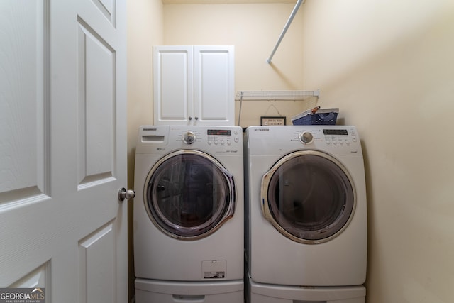 300 Brackin Trce, Grayson, GA 30017 - laundry room with cabinet space and separate washer and dryer