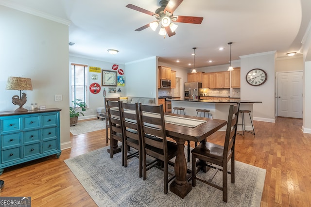 300 Brackin Trce, Grayson, GA 30017 - dining area with ceiling fan, crown molding, light wood-style floors, and recessed lighting