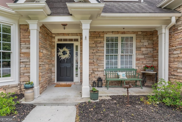 300 Brackin Trce, Grayson, GA 30017 - property entrance with covered porch, a shingled roof, and stone siding