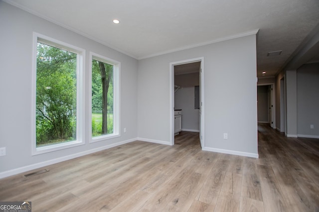 74 Preacher Smith Rd SE, Silver Creek, GA 30173 - spare room with crown molding, baseboards, light wood-style floors, and recessed lighting