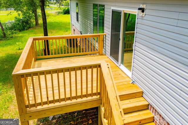 74 Preacher Smith Rd SE, Silver Creek, GA 30173 - wooden deck with a lawn
