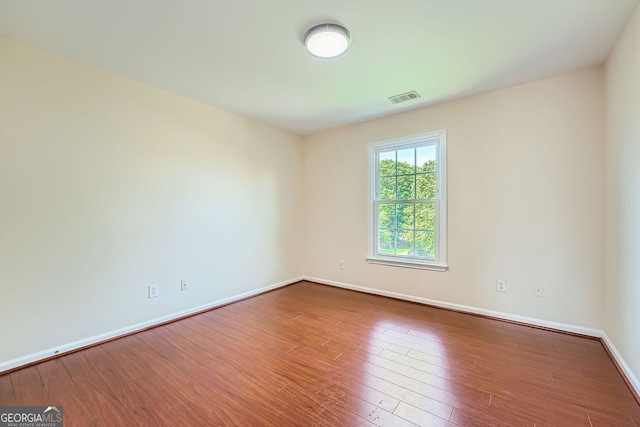1713 Paramore Pl NE, Marietta, GA 30062 - spare room featuring hardwood / wood-style floors and baseboards