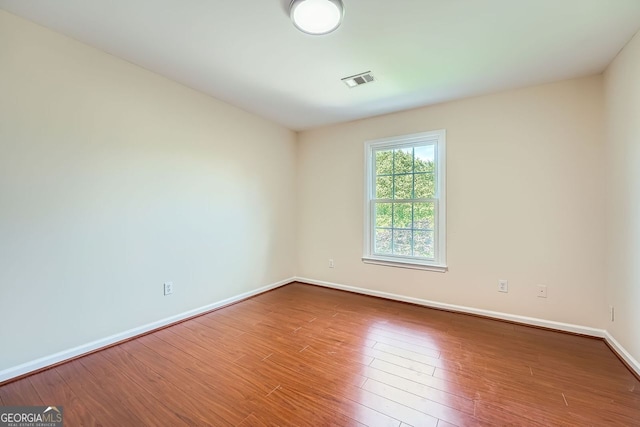 1713 Paramore Pl NE, Marietta, GA 30062 - spare room with baseboards and wood finished floors