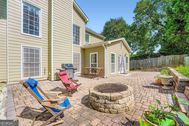 1713 Paramore Pl NE, Marietta, GA 30062 - view of patio with an outdoor fire pit and area for grilling