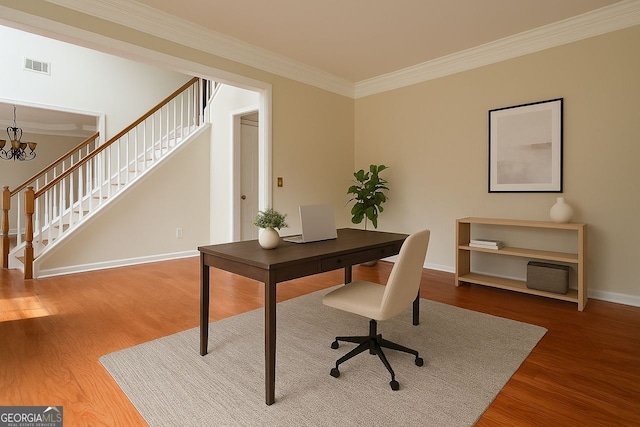 1713 Paramore Pl NE, Marietta, GA 30062 - home office with wood finished floors, crown molding, and a chandelier