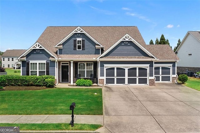 17 Twelve Oaks Dr, Cartersville, GA 30120 - craftsman-style house featuring an attached garage, driveway, a front yard, and brick siding