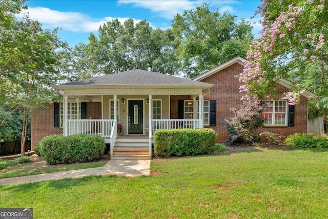 11 Chestnut St, Cartersville, GA 30120 - view of front of property with a porch, brick siding, and a front lawn