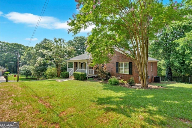 11 Chestnut St, Cartersville, GA 30120 - view of front of property with a porch, central AC, and brick siding