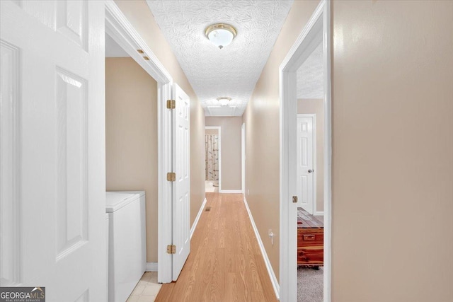 11 Chestnut St, Cartersville, GA 30120 - hall featuring baseboards, a textured ceiling, and light wood-style flooring