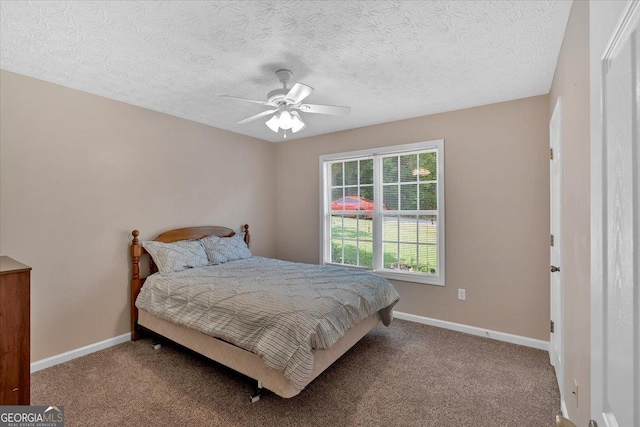 11 Chestnut St, Cartersville, GA 30120 - carpeted bedroom featuring a textured ceiling, baseboards, and a ceiling fan