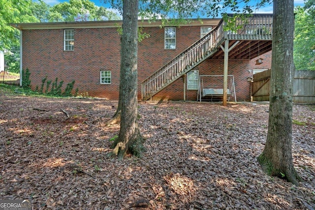 11 Chestnut St, Cartersville, GA 30120 - back of property featuring stairs, brick siding, and a deck