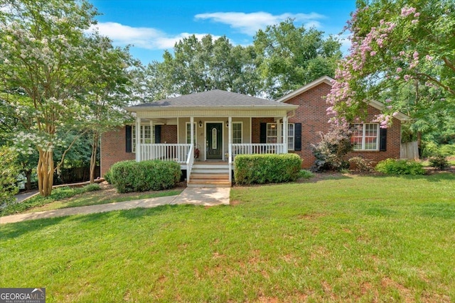 11 Chestnut St, Cartersville, GA 30120 - view of front of property featuring a porch, brick siding, and a front yard