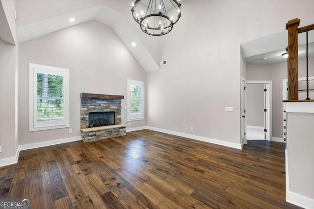 12 Bridgestone Way SE, Cartersville, GA 30120 - unfurnished living room featuring high vaulted ceiling, a chandelier, recessed lighting, wood finished floors, and a stone fireplace