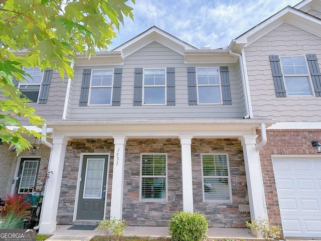 1531 Iris Walk, Jonesboro, GA 30238 - multi unit property with a garage, covered porch, and stone siding