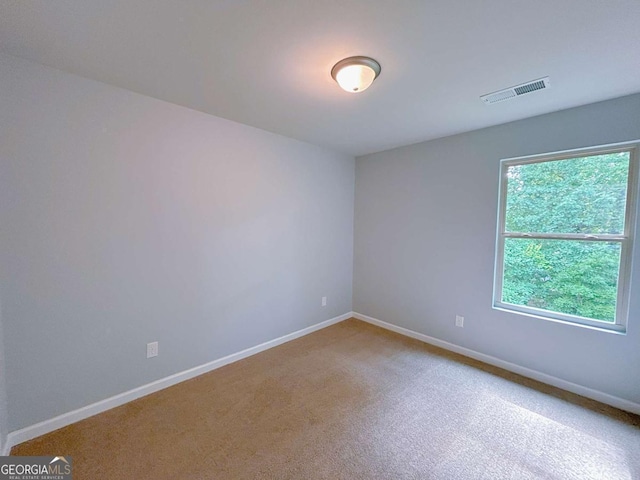 1892 Old Dogwood, Jonesboro, GA 30238 - carpeted spare room featuring baseboards