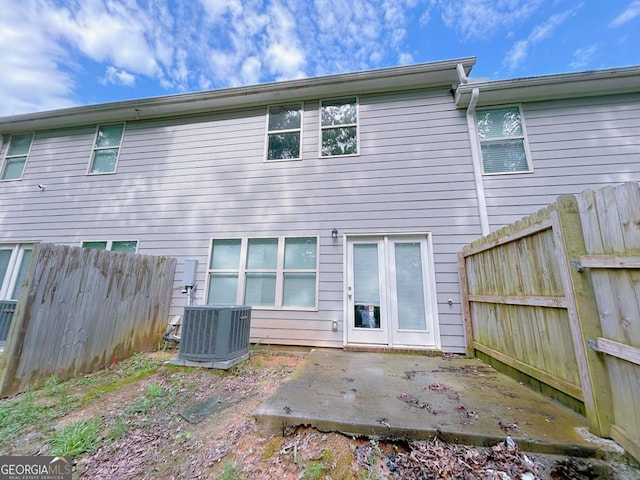 1892 Old Dogwood, Jonesboro, GA 30238 - back of house featuring central AC unit, a patio, and a fenced backyard