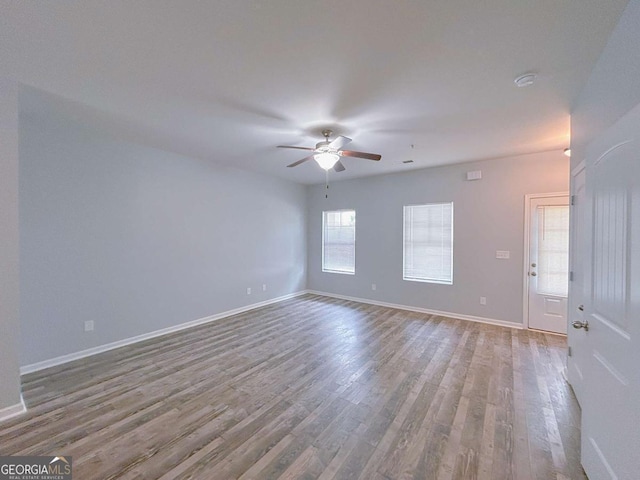 1892 Old Dogwood, Jonesboro, GA 30238 - spare room featuring a ceiling fan, wood finished floors, baseboards, and a smoke detector