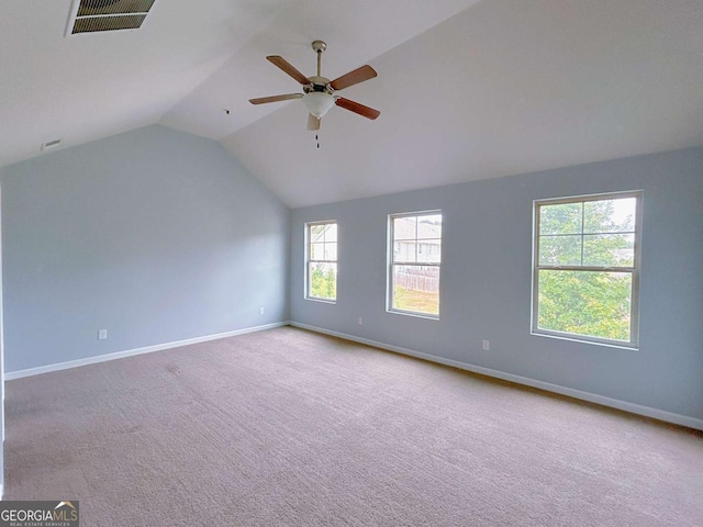 1892 Old Dogwood, Jonesboro, GA 30238 - unfurnished room featuring vaulted ceiling, baseboards, carpet, and ceiling fan