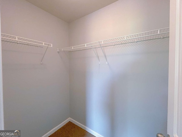1892 Old Dogwood, Jonesboro, GA 30238 - spacious closet featuring dark carpet