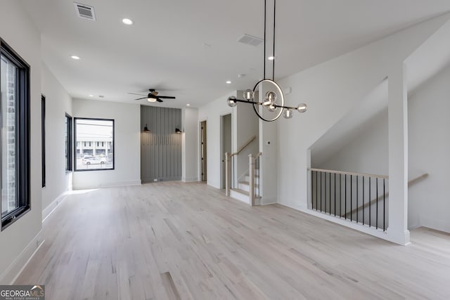 1962 8th St, Chamblee, GA 30341 - unfurnished living room featuring light wood-style floors, ceiling fan, recessed lighting, a chandelier, and baseboards