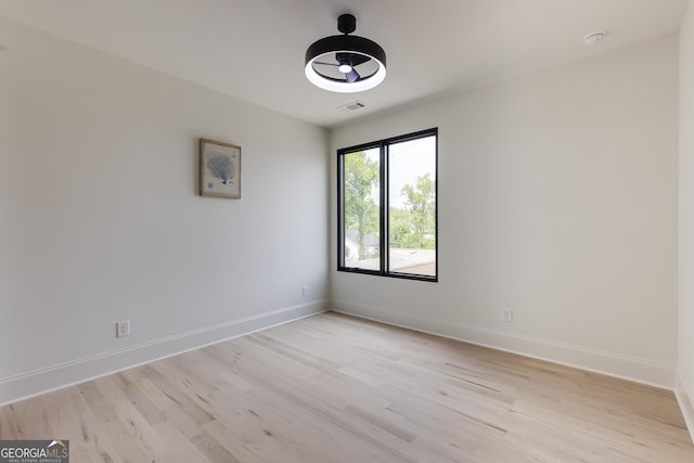1962 8th St, Chamblee, GA 30341 - unfurnished room featuring light wood finished floors, baseboards, and a smoke detector