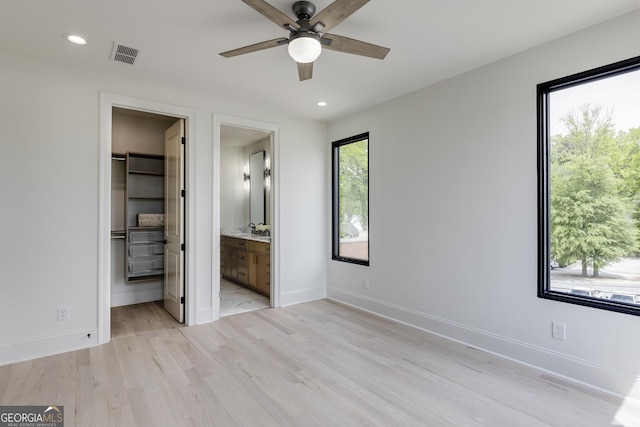 1962 8th St, Chamblee, GA 30341 - unfurnished bedroom featuring a spacious closet, light wood finished floors, baseboards, and recessed lighting
