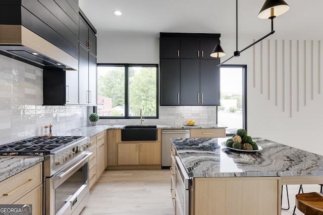 1962 8th St, Chamblee, GA 30341 - kitchen with appliances with stainless steel finishes, custom exhaust hood, a sink, plenty of natural light, and recessed lighting