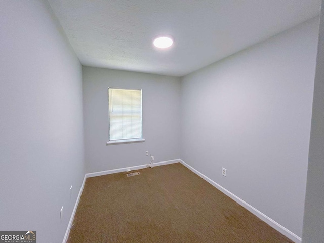 1820 Neely Ave, Atlanta, GA 30344 - empty room with baseboards and dark colored carpet
