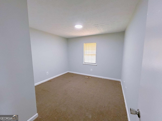 1820 Neely Ave, Atlanta, GA 30344 - unfurnished room featuring baseboards, carpet floors, and a textured ceiling
