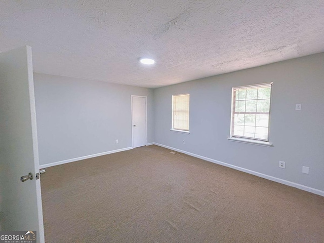 1820 Neely Ave, Atlanta, GA 30344 - carpeted empty room featuring a textured ceiling and baseboards
