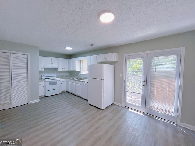 1820 Neely Ave, Atlanta, GA 30344 - kitchen with white appliances, baseboards, a textured ceiling, under cabinet range hood, and light wood-style flooring