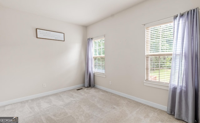 1049 Climbing Rose Way, Mcdonough, GA 30253 - empty room featuring baseboards and light colored carpet